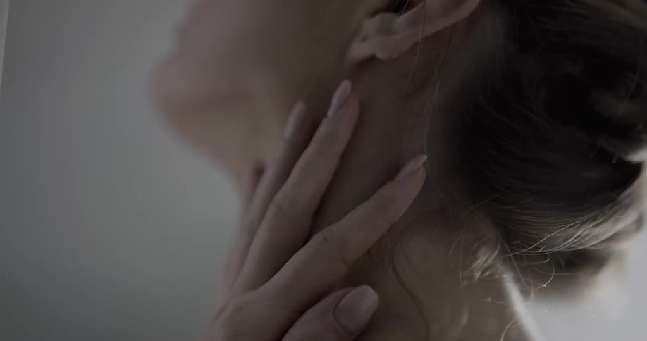 A close up of a womans ear and neck