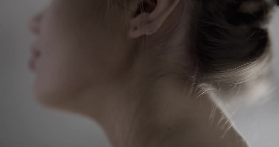 A woman rubbing her neck