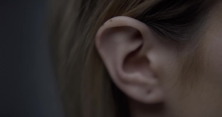 A close up of a womans ear