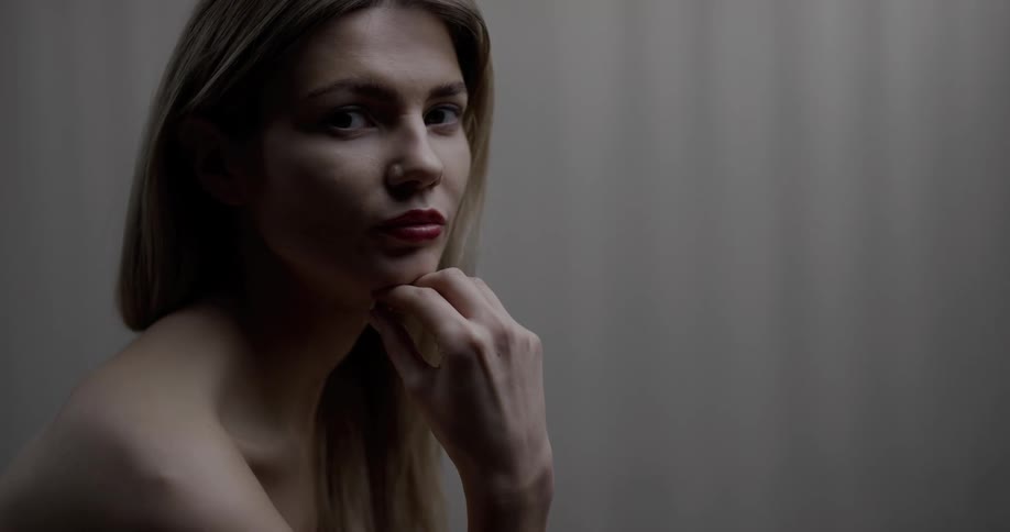 A woman in a room staring