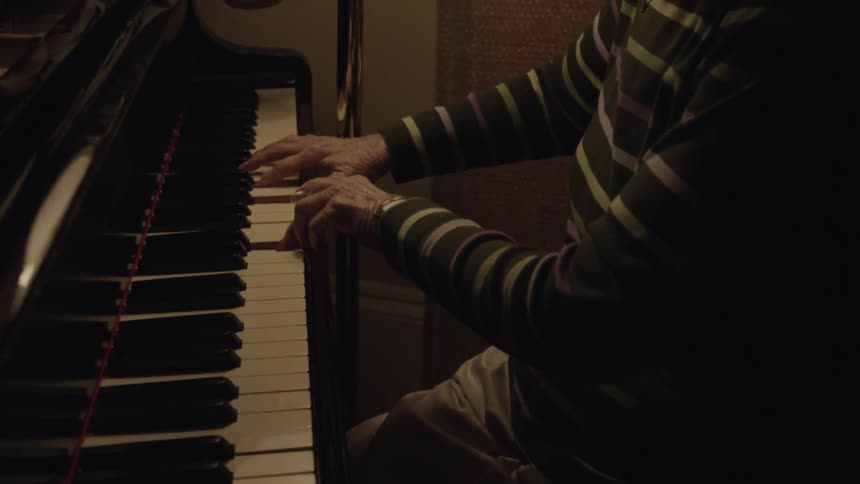 A women plays the piano
