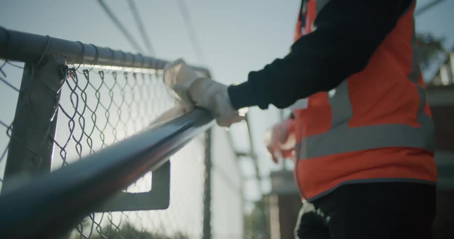 An employee cleaning off a banister