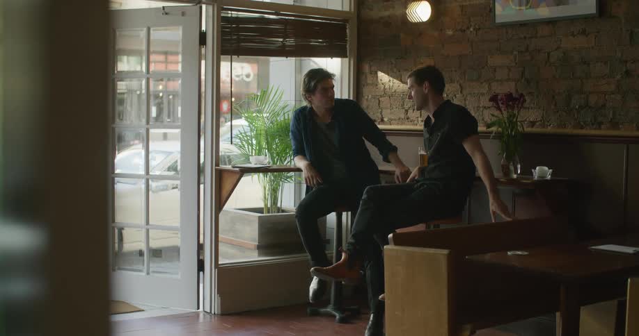 Two men sitting and talking
