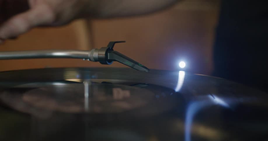 A person playing a vinyl record