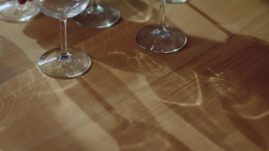 A close up of wine glasses on a table