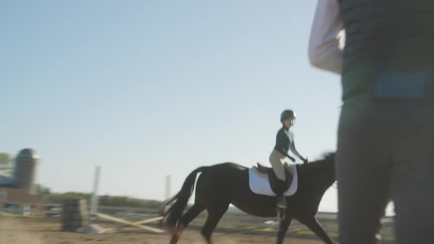 A woman riding a horse
