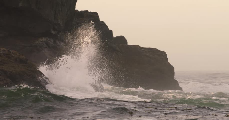 Waves crashing in to a cliff on the shore