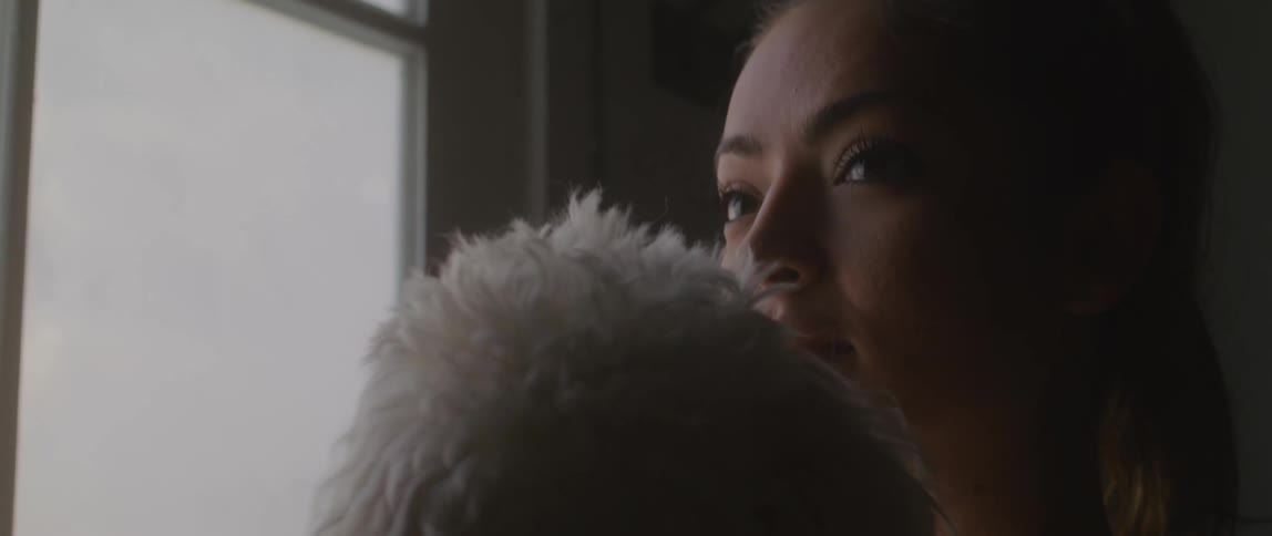 A woman holding her dog
