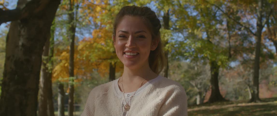 A woman posing for a video