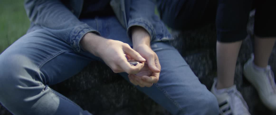 Person rubbing and moving object through their hands