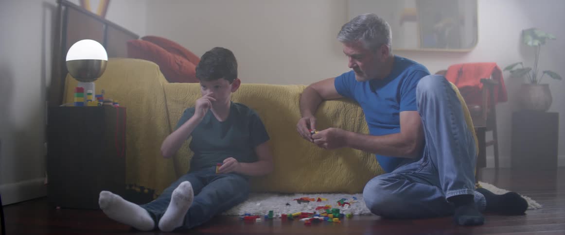 Father and son building with legos