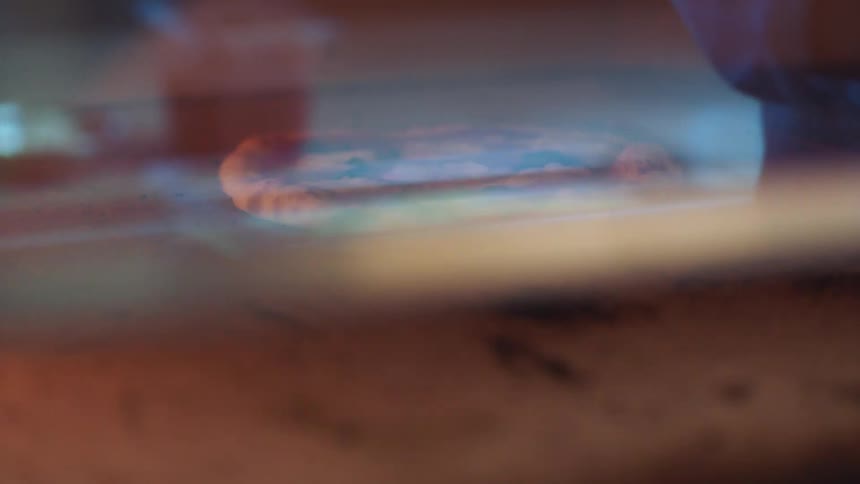 A pizza is cooking in an oven