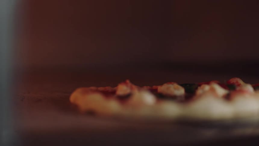 A pizza is cooking in an oven
