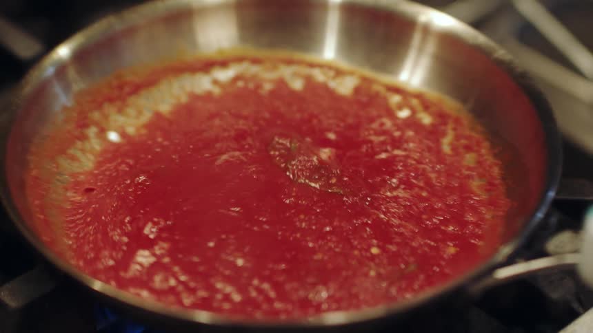 A close up of a sauce reducing