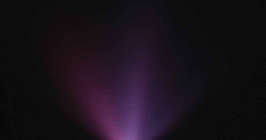 A purple light is flashing outdoors at night