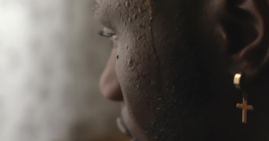 A man is standing inside a room and looking at something