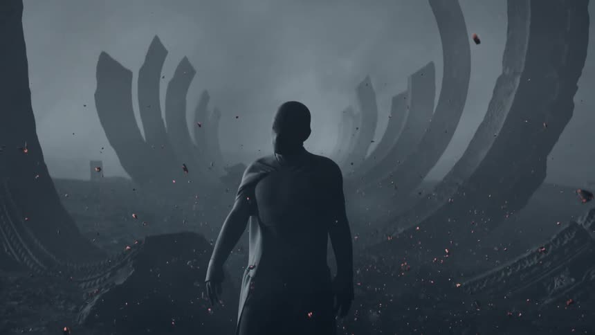 A humanoid slowly stands up and turns to face the a line of large constructed half ring structures