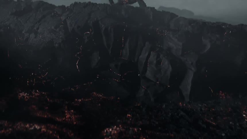 A humanoid like figure with embers all over its body gets up from the ground