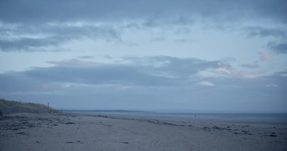 Coastal beach shoreline on a cloudy day