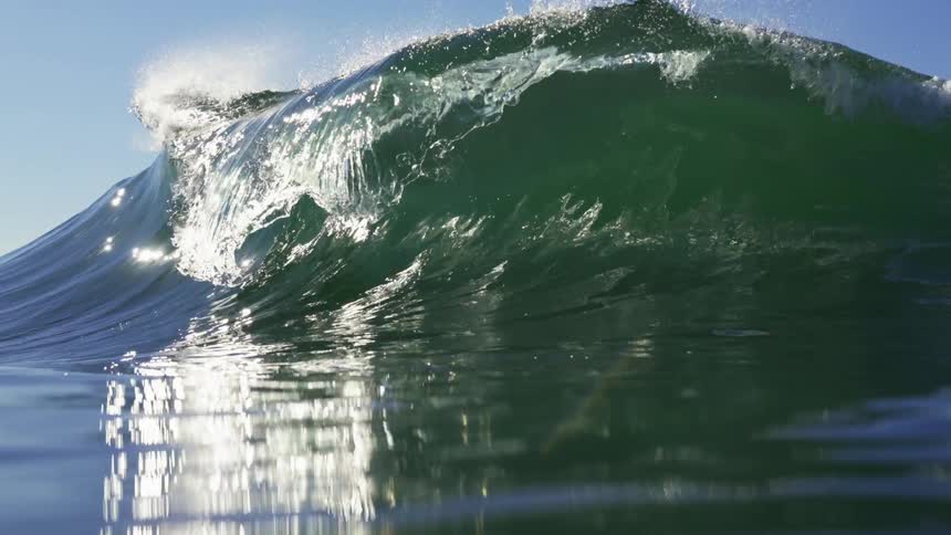 An ocean wave crashing with the ocean