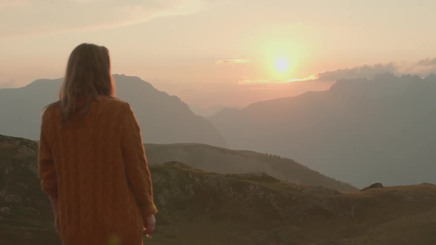 A woman looking out into the sunset