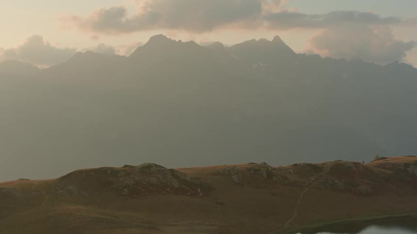 Landscape of cloudy sky mountains and sand dunes