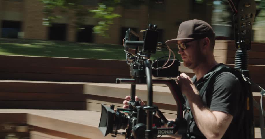 A man controlling a camera with a gimbal