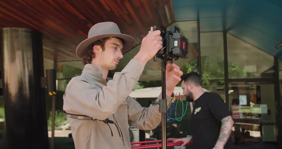 A crew are setting up cameras
