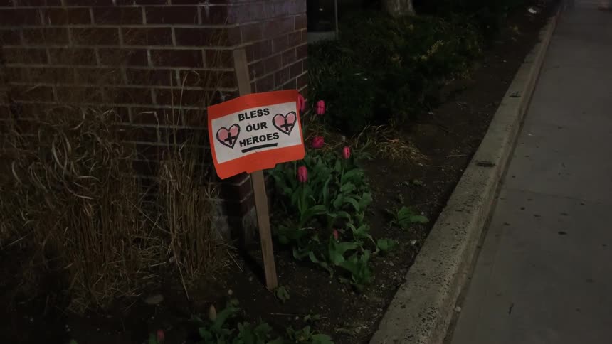 Emergency lights flash on the sign outside