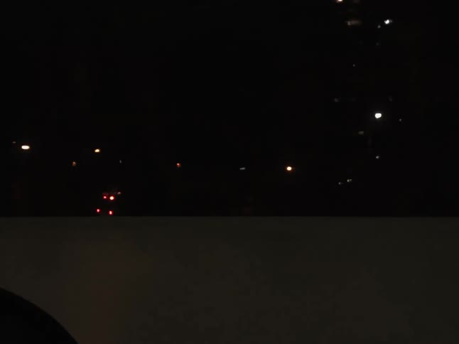 Ambulance driving on the city streets at night