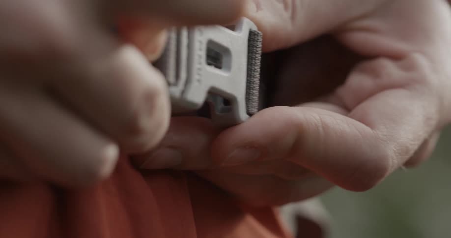A person snaps a clasp together