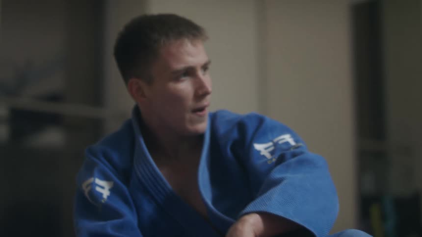 A teenage boy slams his fist down in anger