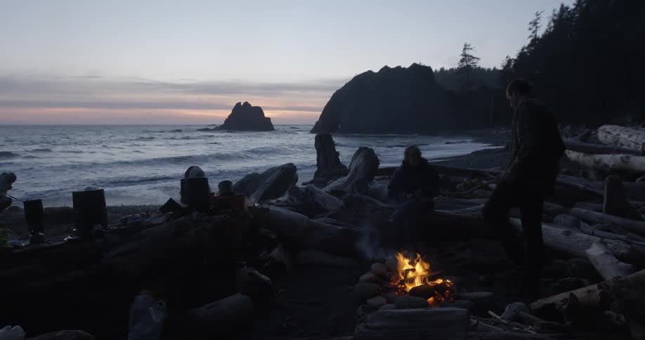 People sitting around a campfire