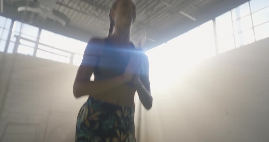 A woman doing exercises in a room
