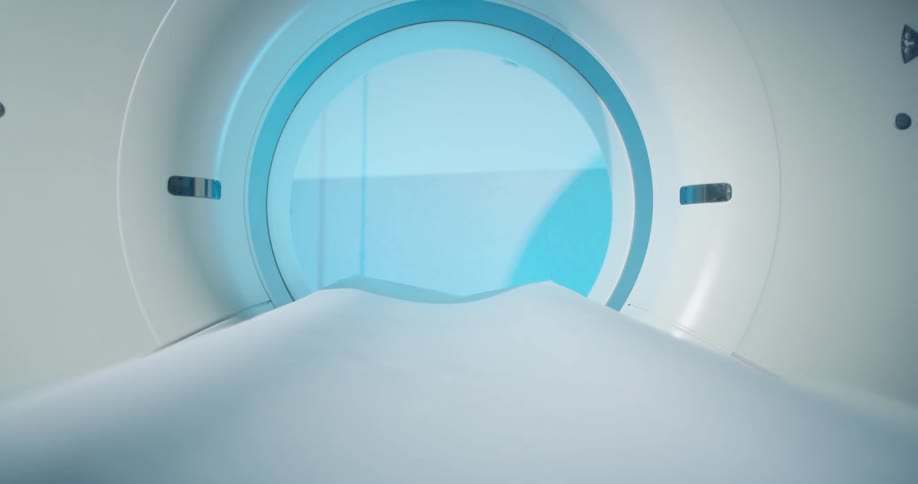 The platform the patients lays on moves out from bore of a magnetic resonance imaging scanner