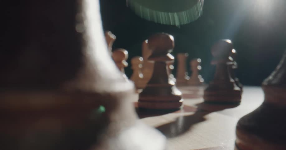 A person is playing chess indoors