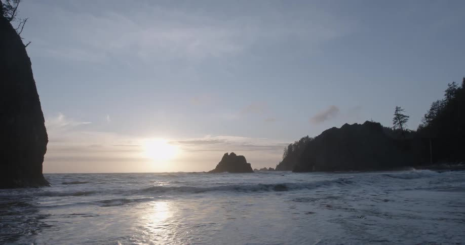 Waves washing onshore at sunset