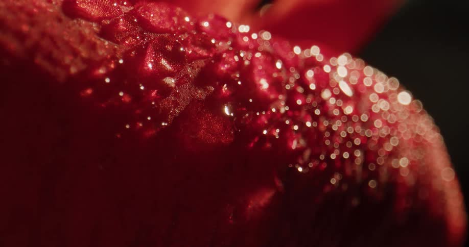 A red surface with water droplets