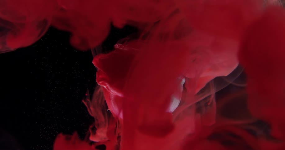 Red dye clouds float and sink in black