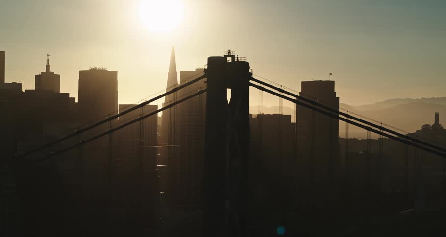 A wide shot of a city with a bridge