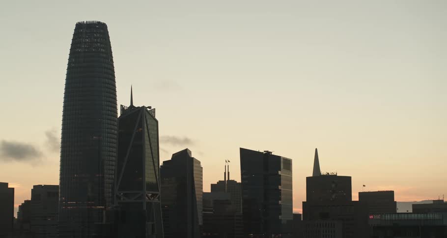 Skyline of city with buildings at dusk with little clouds