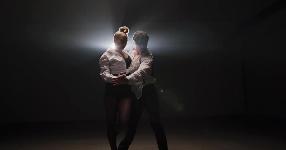 Two people dancing on a stage