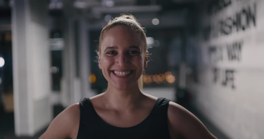 A woman smiling indoors