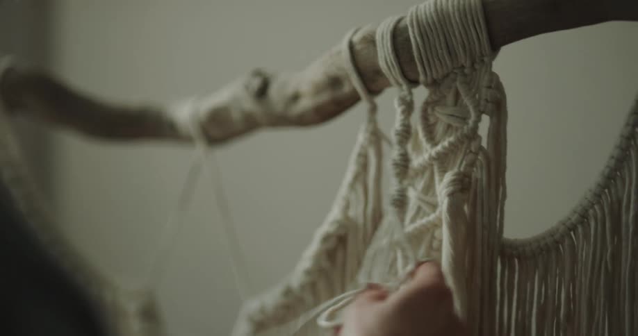 A person weaving clothes