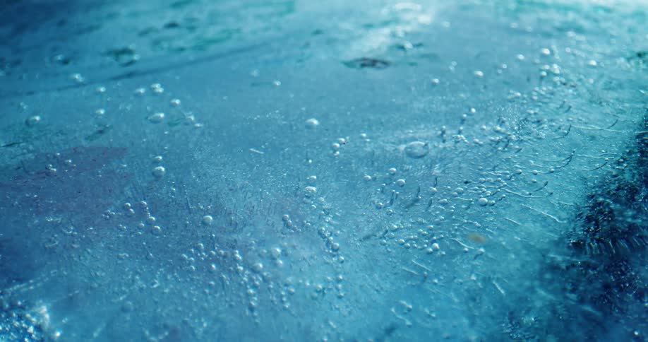 Close up of frozen water with thickness layers and bubbles