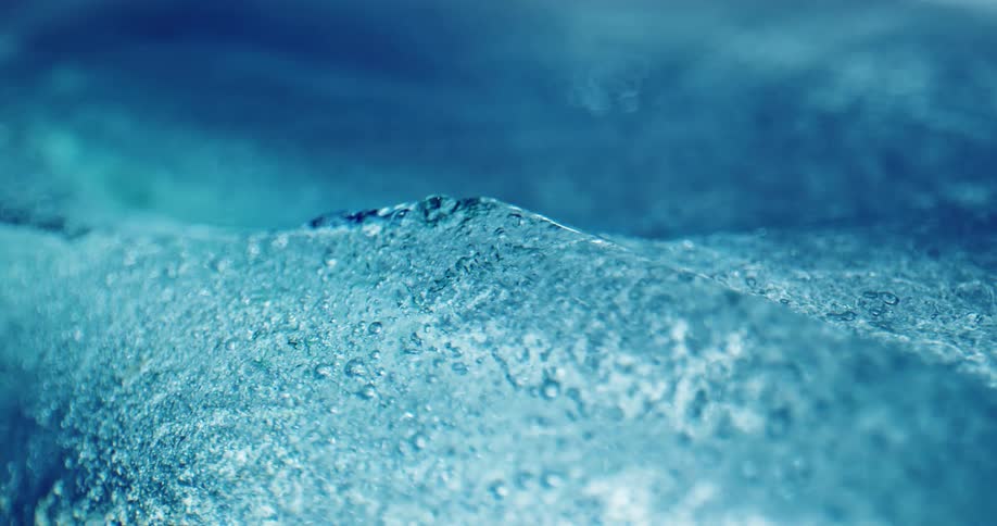 Droplets of water and ice crystals on chunks of ice