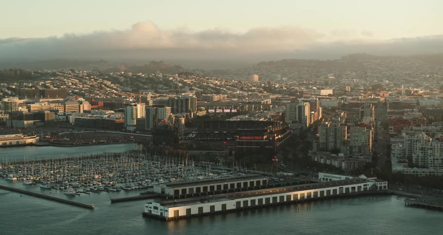 Aerial view of boats in the dock and the city skyline with office buildings and high rises