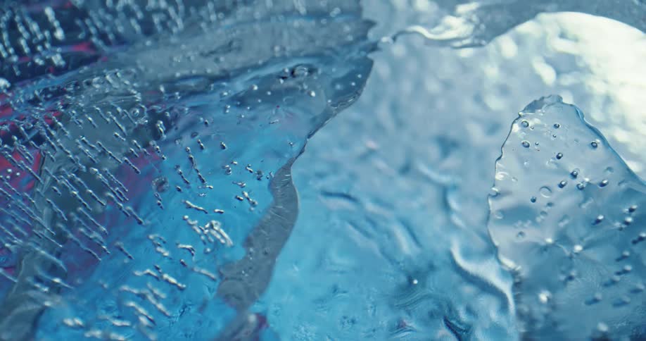 Close up of a clear ice structure melting in layers
