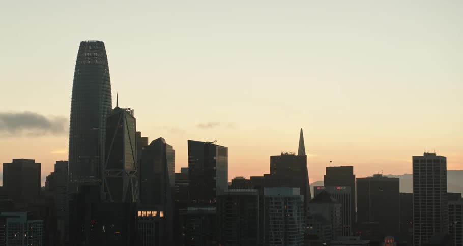 Skyline with buildings at dawn with a mountain to the right
