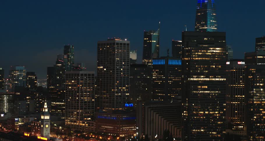 A view of a city at night with the lights on